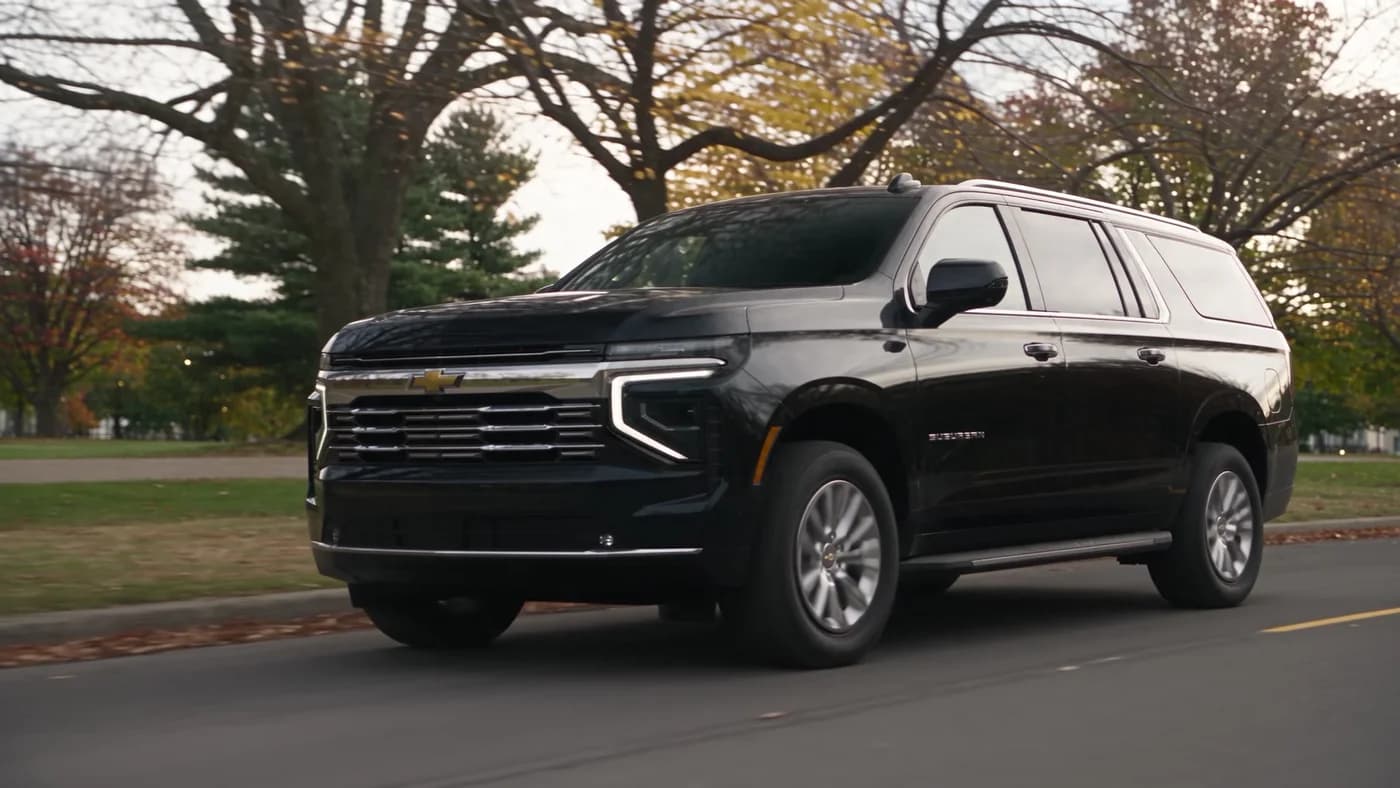 Black Chevrolet Suburban driving along an Ottawa roadway